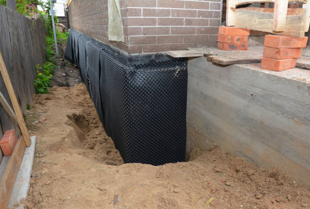SJ Waterproofing Pros technician performing targeted Exterior Waterproofing assessment in Florence, AL